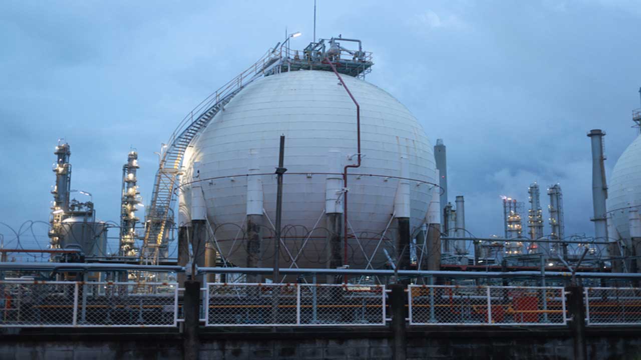 propane storage sphere tanks in factories on a sunset blue sky background